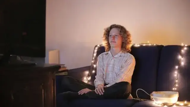 Couple watching TV together in a living room