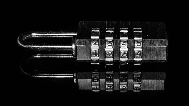 Combination padlock on a black background symbolizing app security